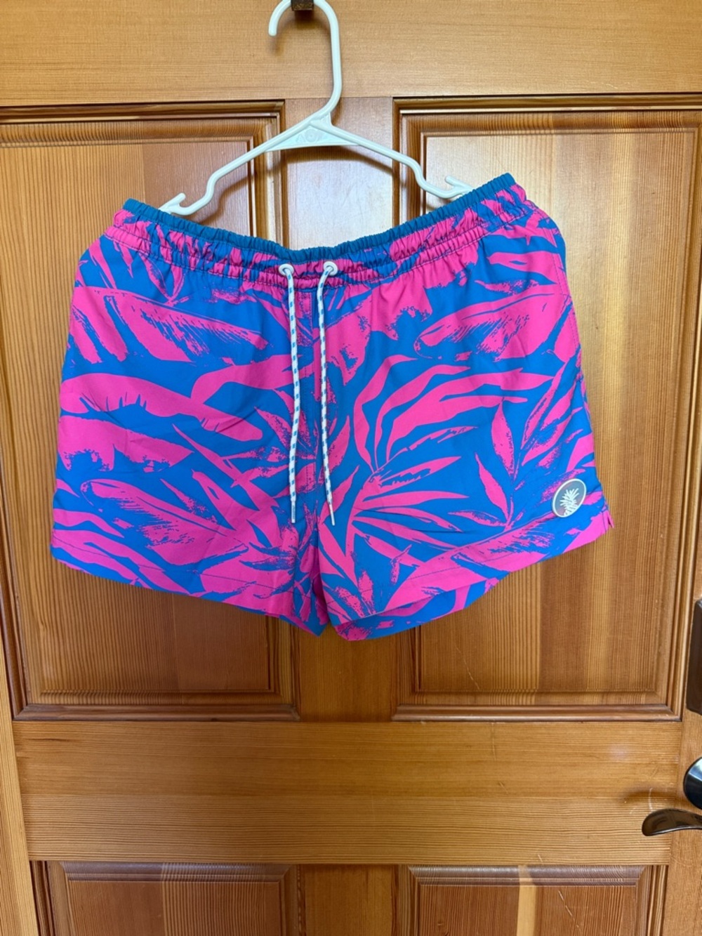 Men’s Chubbies Pink & Blue Tropical Print Swim Shorts. No liner, mesh pockets.